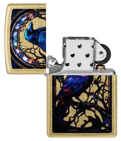 Zippo Stained Glass Raven Design Street Brass Windproof Lighter with its lid open and unlit.