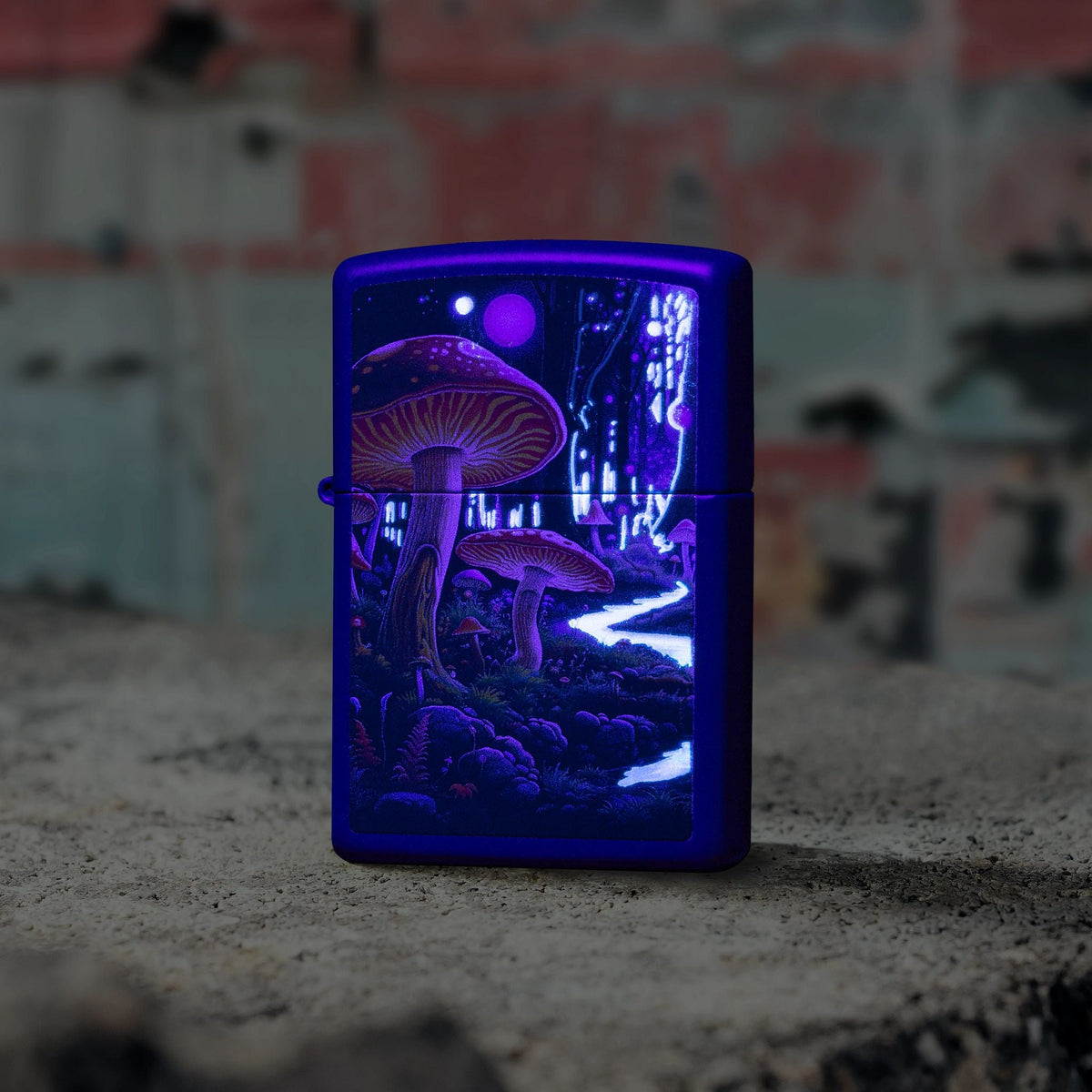 Lifestyle image of Zippo Black Light Mushroom Design Navy Matte Windproof Lighter standing on concrete in front of a graffiti covered wall showing the front of the lighter, while glowing under a black light. 


