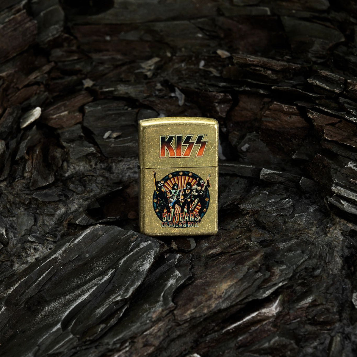 Lifestyle image of Zippo KISS® 50 Years Design Street Brass Windproof Lighter standing in a close up of a salt cave.